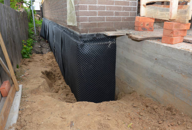 SJ Waterproofing Pros technician performing targeted Interior Drainage System assessment in Marshall, MI